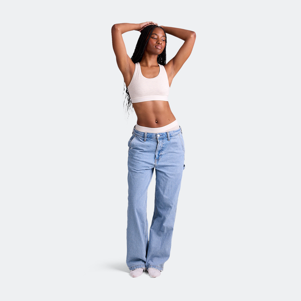 Maelyn wears a size M